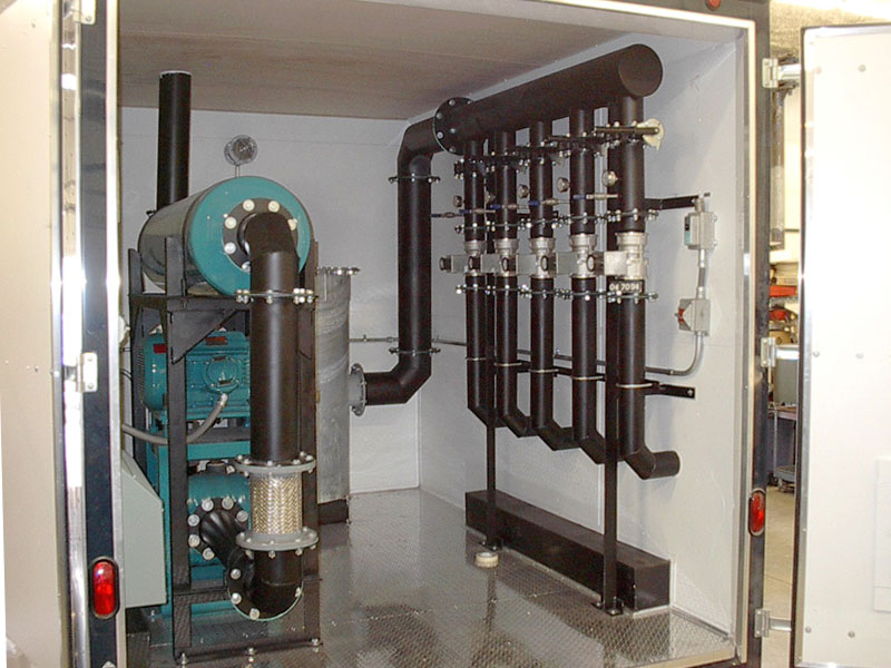 Trailer mounted high volume vapor extraction system to pull soil vapors from a gasoline spill. 